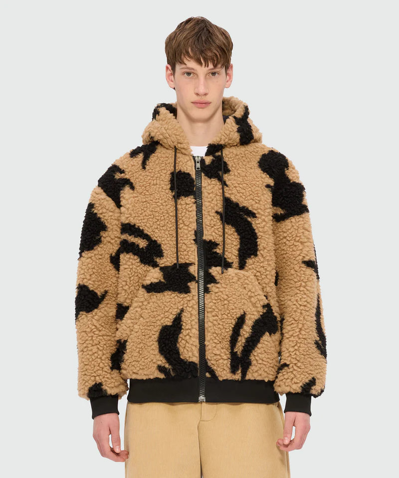Beige teddy jacket with Follow the Rabbit motif, drawstring hood, zip closure, and kangaroo pockets.