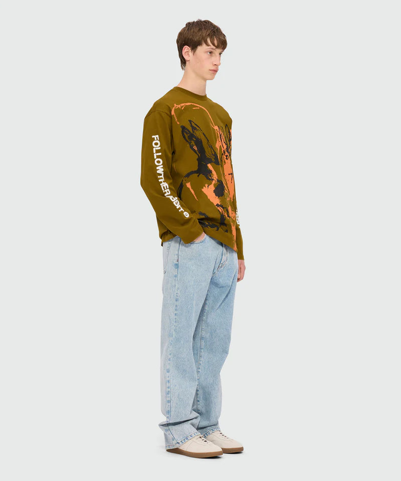 Olive green jersey T-shirt with Sketched Bunnies print and Follow the Rabbit quote on sleeves, worn by male model.