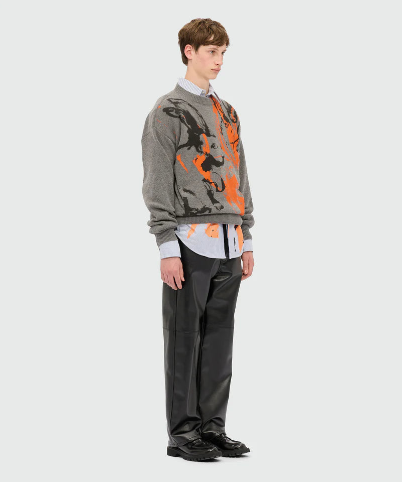 Grey sweater with Sketched Bunnies print worn with shirt and pants stylishly on model standing side view.