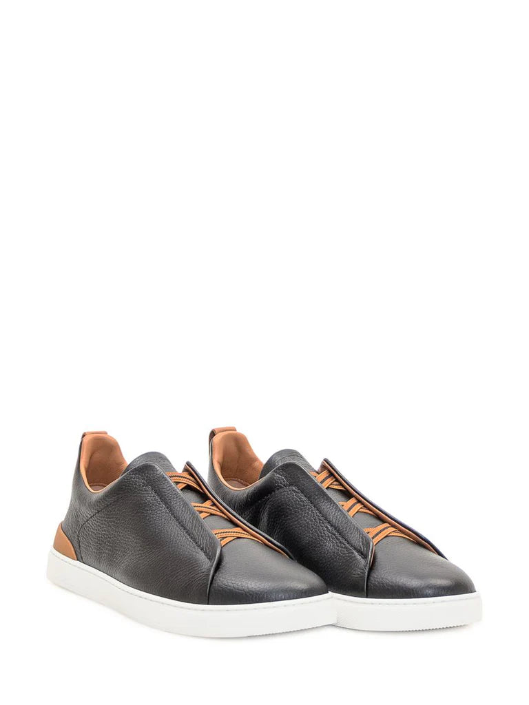 Zegna Men’s Black Grained Leather Slip-On Sneakers – White Sole, Leather-Colored Detail