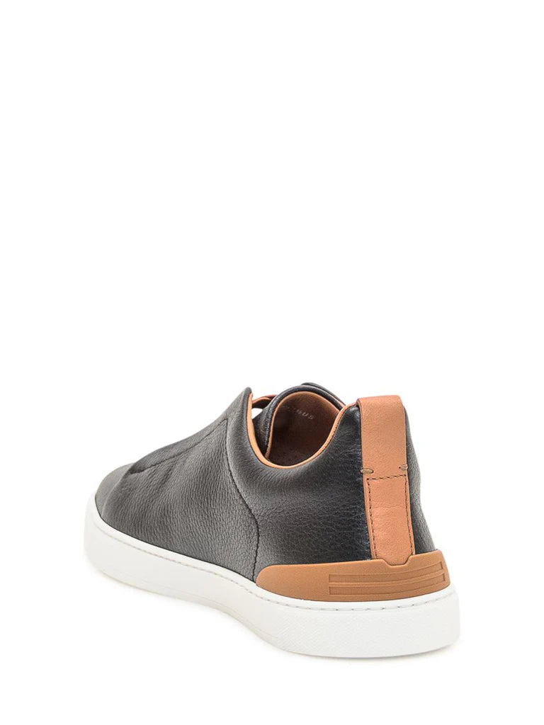 Zegna Men’s Black Grained Leather Slip-On Sneakers – White Sole, Leather-Colored Detail