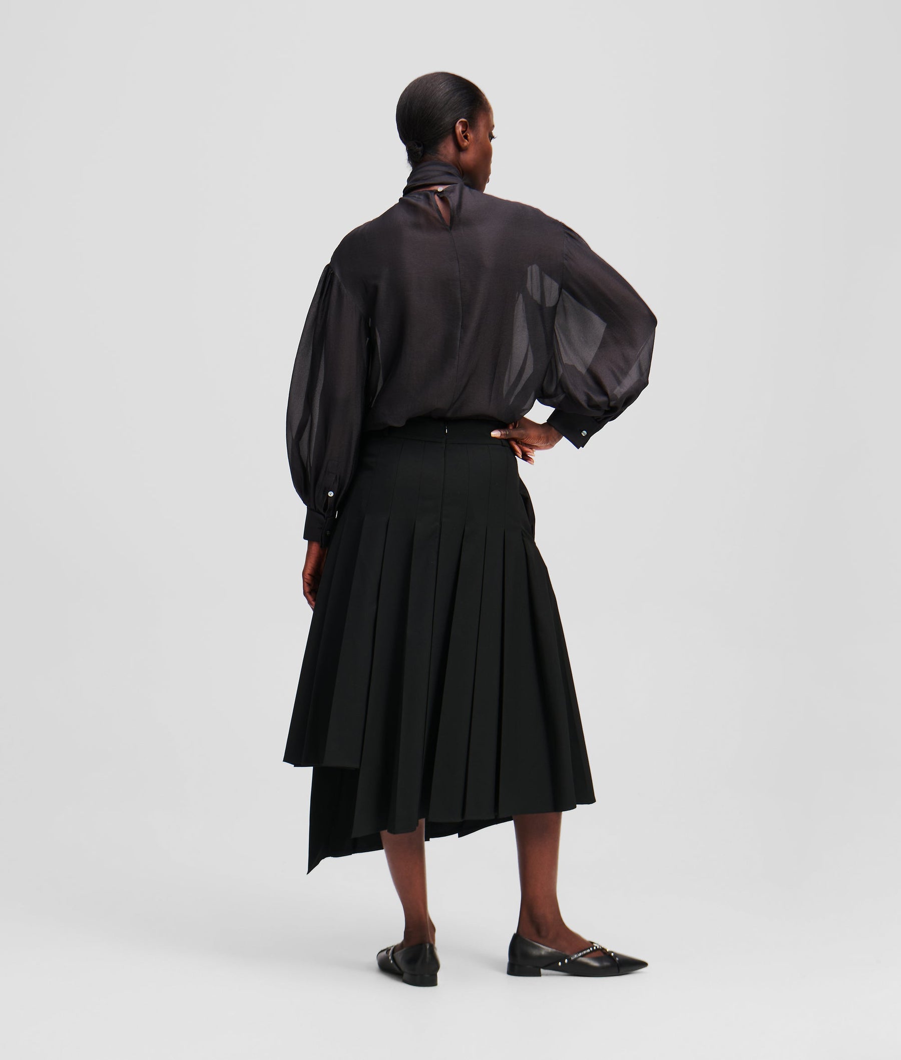 ASYMMETRIC PLEATED SKIRT