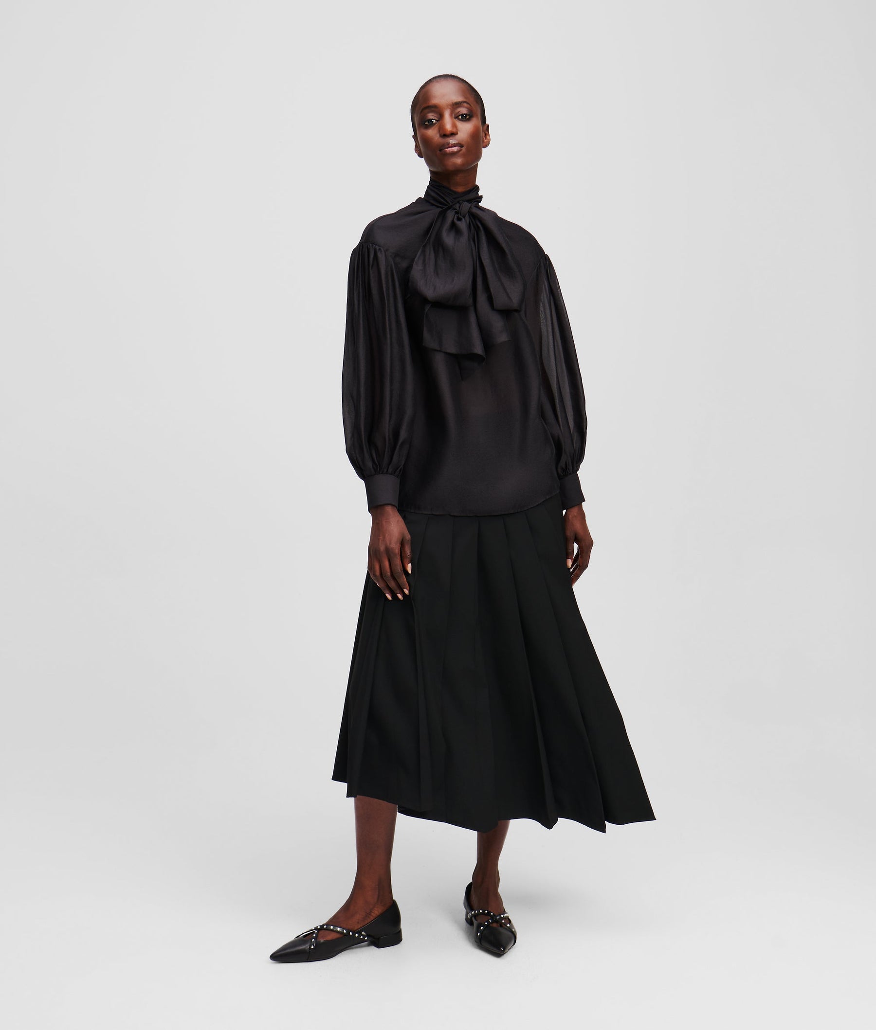 ASYMMETRIC PLEATED SKIRT