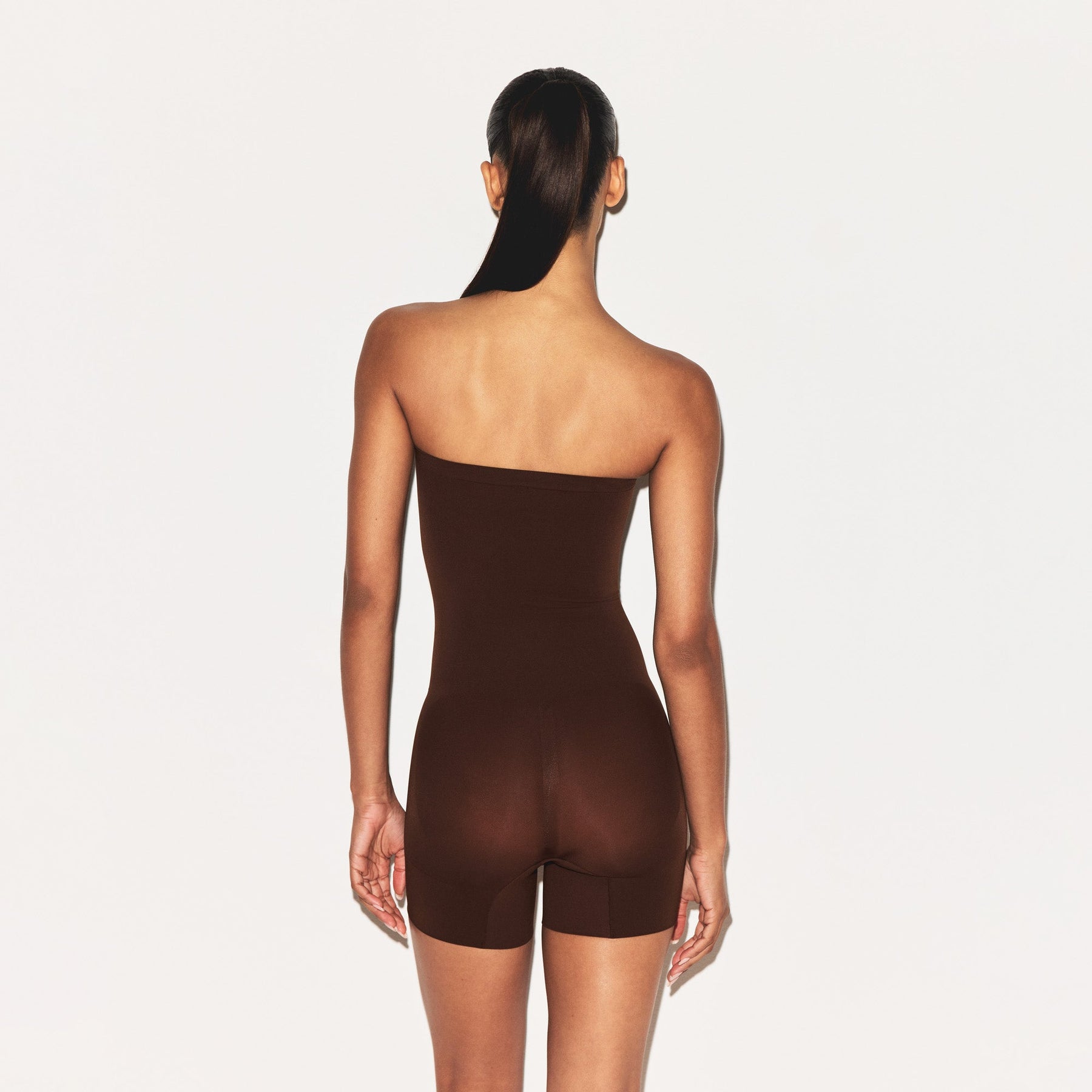 SHEER SEAMLESS STRAPLESS SHORTIE BODYSUIT | COCOA