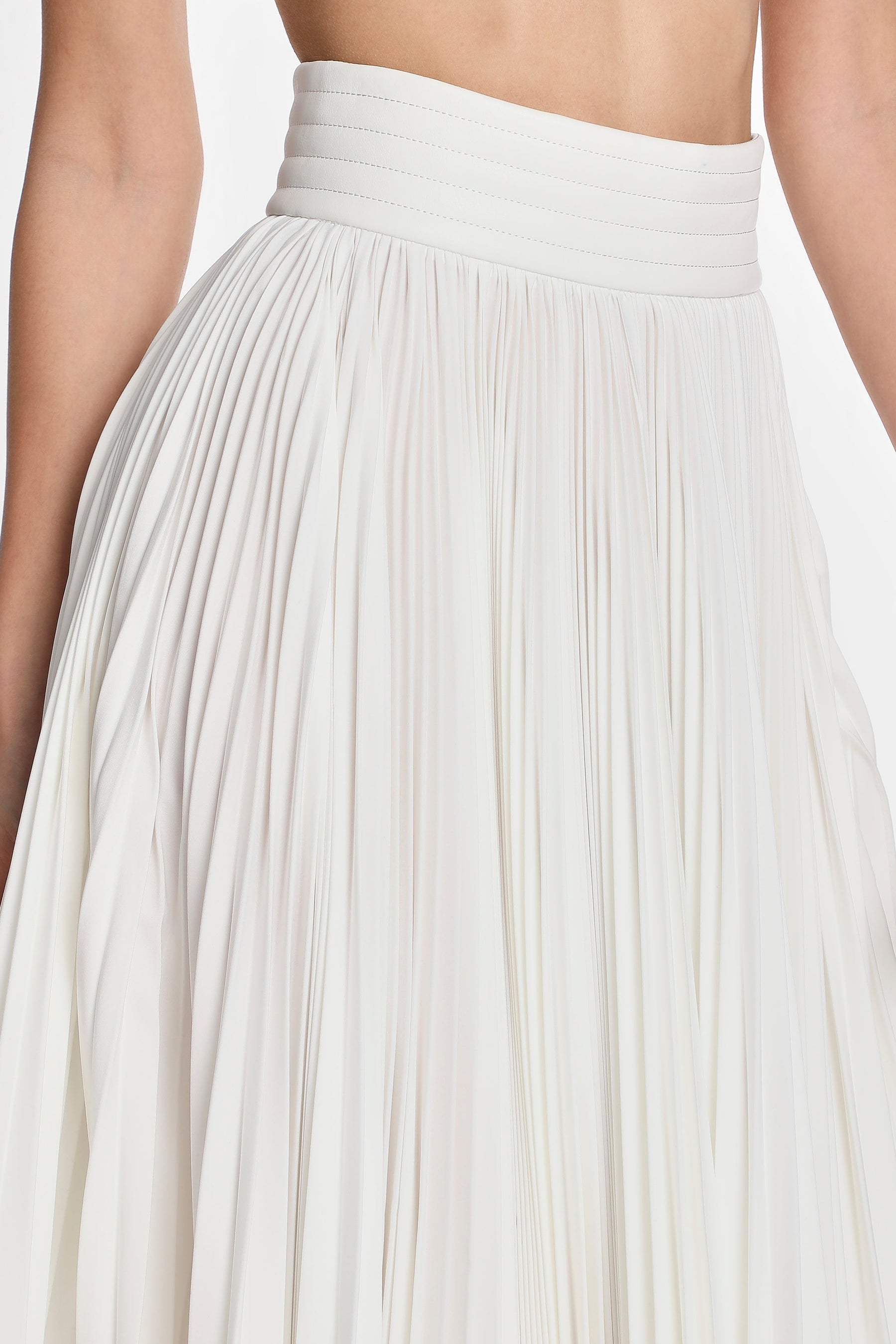 ASYMMETRIC PLEATED SKIRT W/ VEGAN LEATHER WAIST