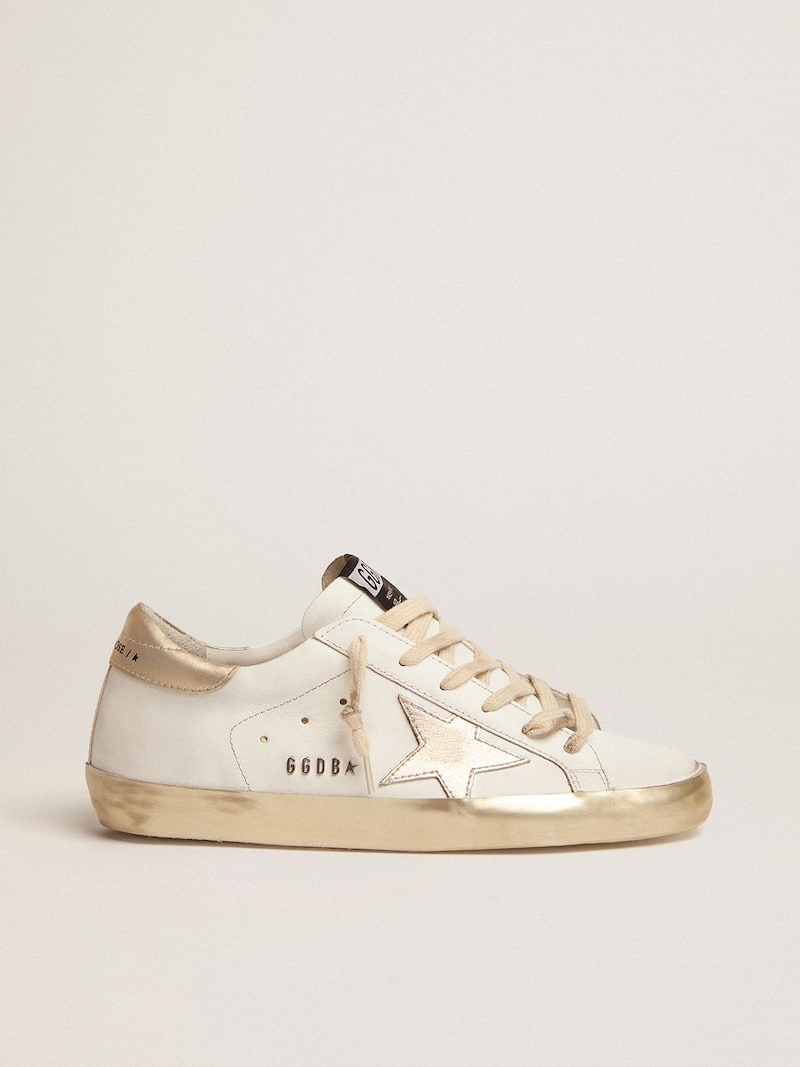 Women's Super-Star with gold sparkle foxing and metal stud lettering