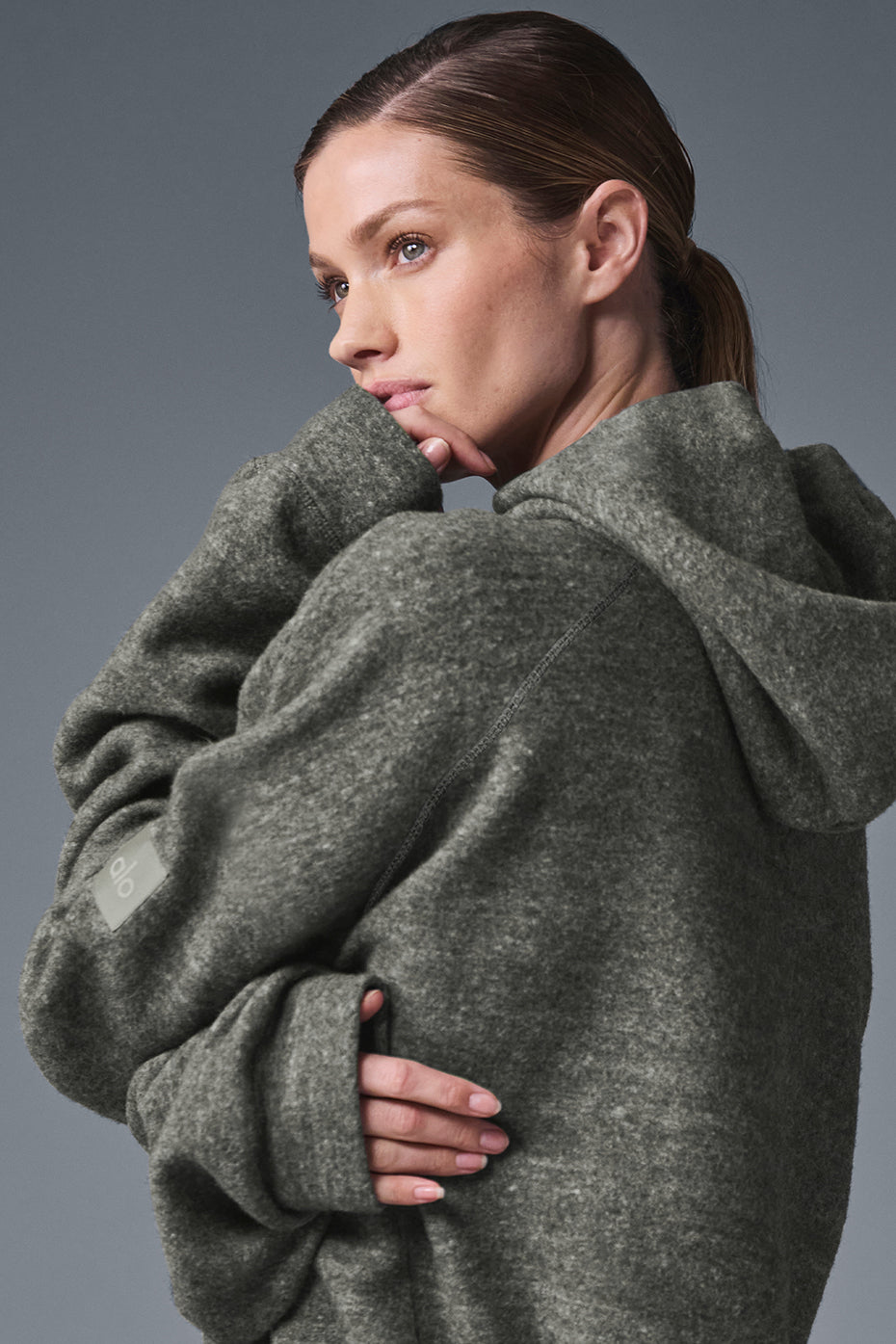 Model wearing Triumph Hoodie showcasing the soft, moisture-wicking fleece with hood and cozy design.