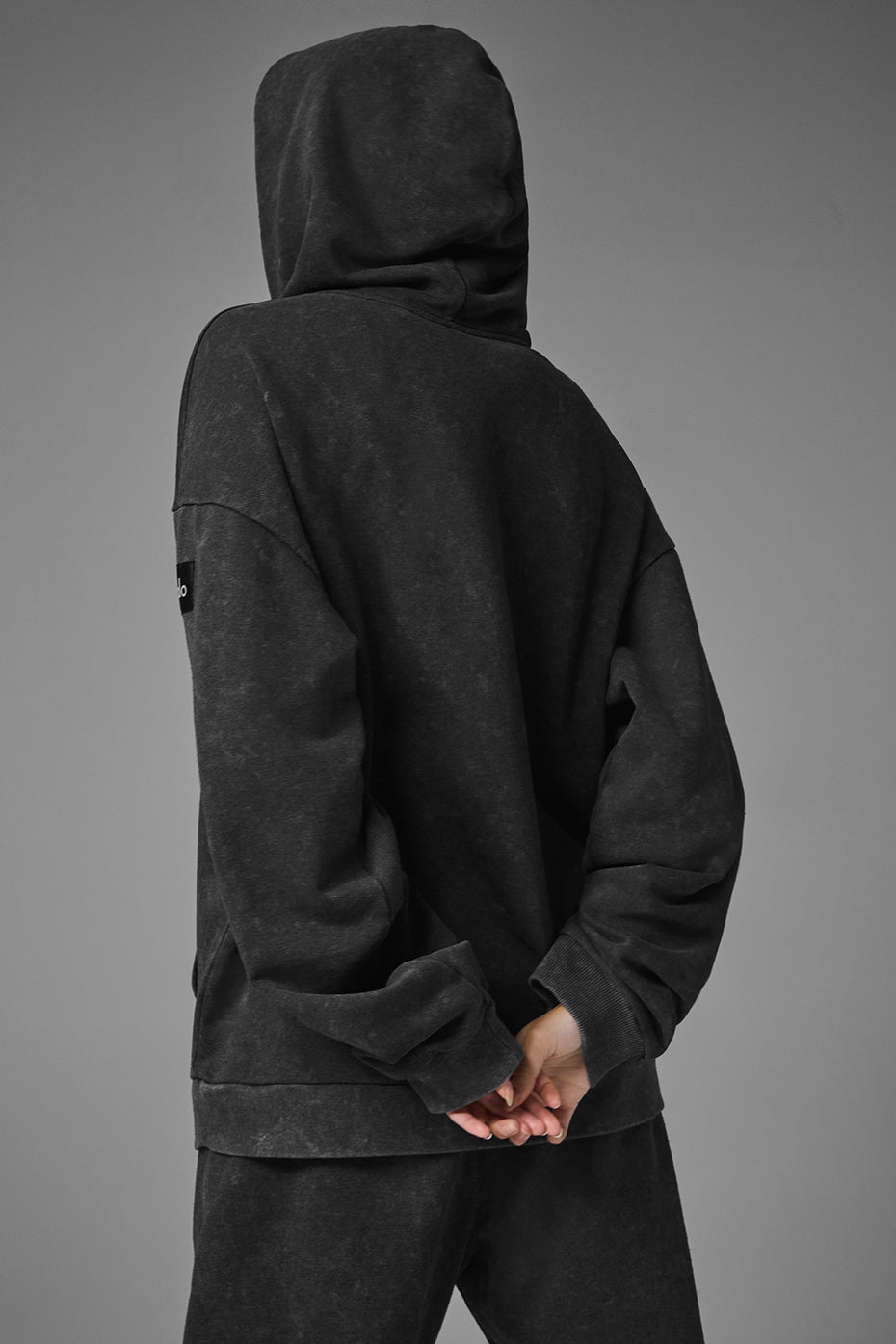 Back view of Chill Vintage Wash Hoodie featuring a casual oversized fit and cozy ribbed cuffs.