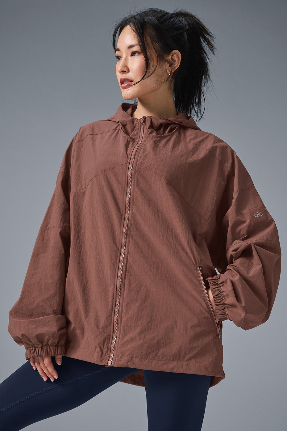 Vantage Nylon Ripstop Track Jacket with structured hood and full-zip front for running and training in cold weather.