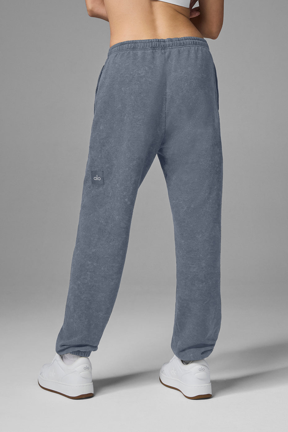 Back view of Chill Vintage Wash Sweatpant in faded blue color, featuring stretchy drawstring waist and cuffed hems.