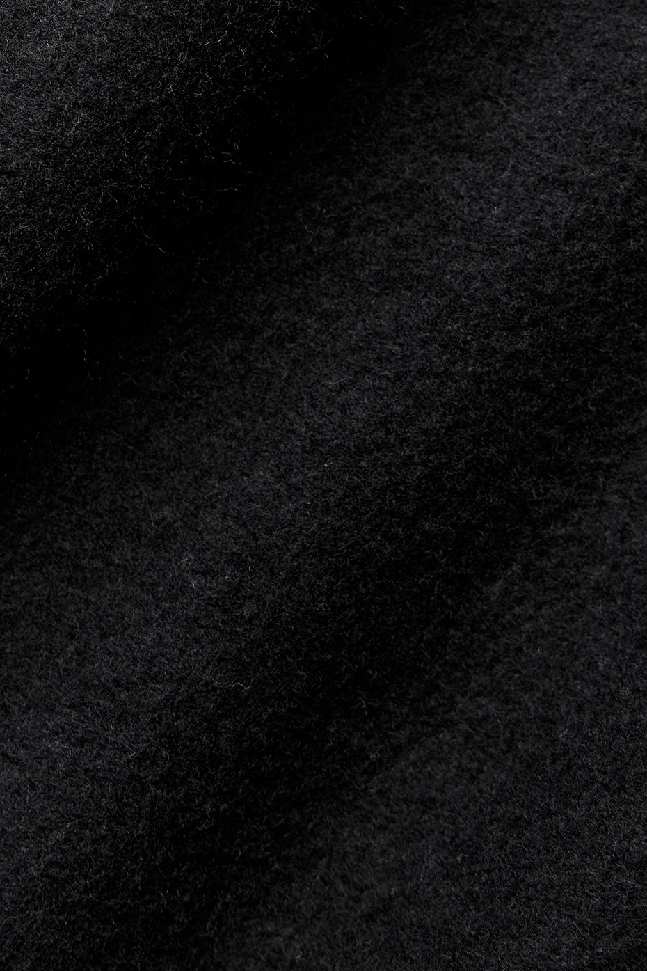 Close-up of soft black fleece fabric used in Triumph Restore Sweatpant for ultimate comfort and coziness.