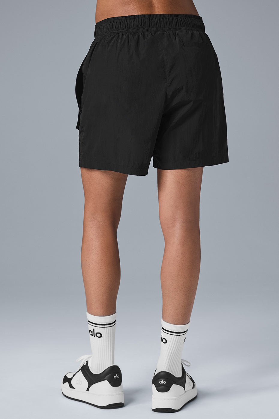Back view of 7 inch black crinkle nylon excursion cargo shorts with comfortable drawstring waist