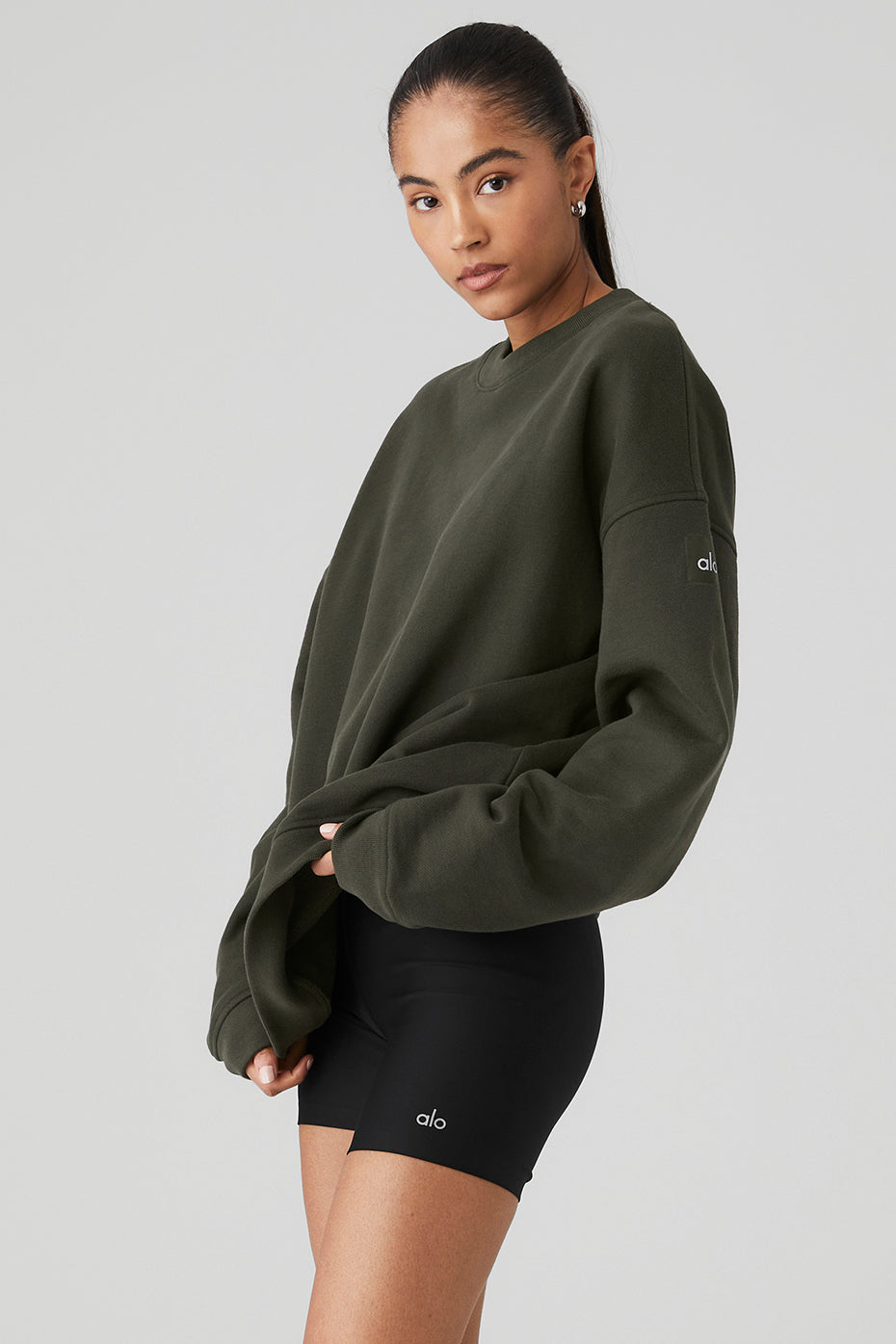Renown Heavy Weight Crew Neck Pullover in olive green, showcasing relaxed fit and dropped shoulders, styled for men and women.