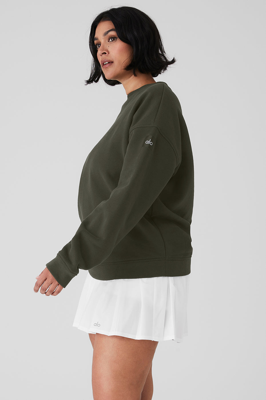Model wearing a green Renown Heavy Weight Crew Neck Pullover with oversized fit and dropped shoulders.