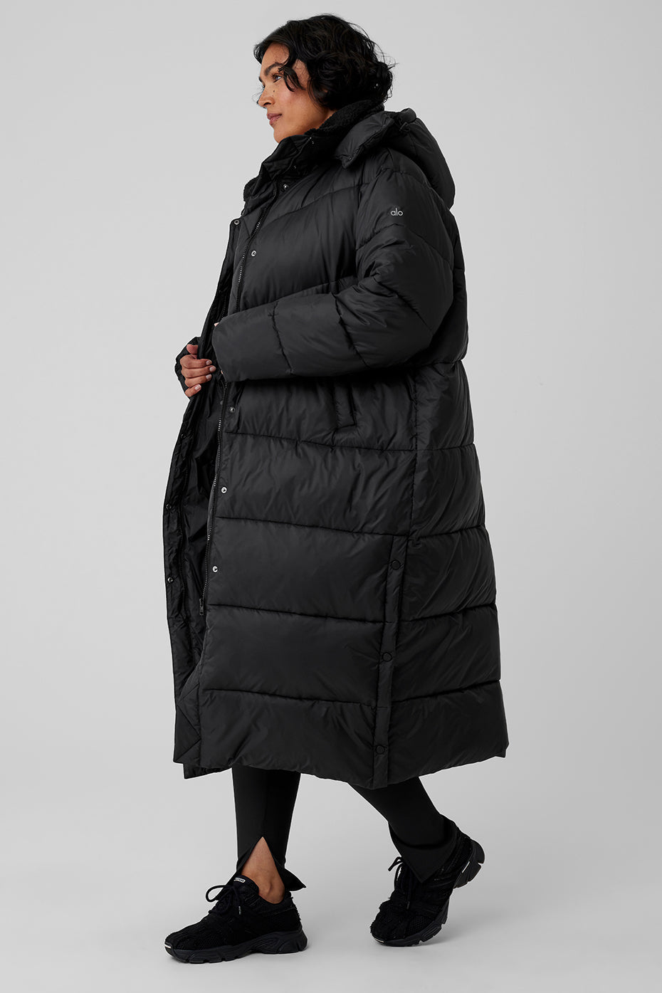Black Gold Rush Puffer Trench featuring oversized fit and sherpa-lined collar for winter warmth.