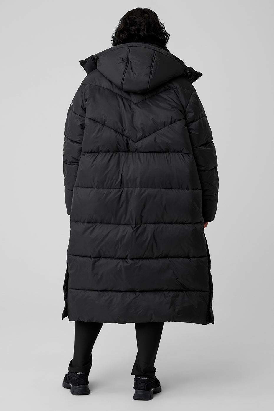 Back view of Gold Rush Puffer Trench showcasing its oversized fit and cozy design for winter weather.