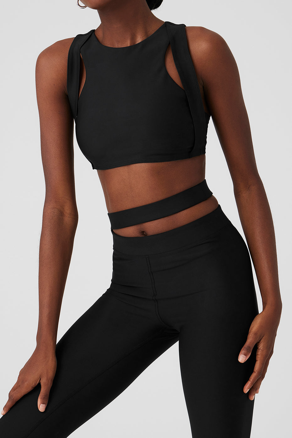 Model wearing Airlift High-Waist All Access Legging and matching Airlift All Access Bra with cutout details