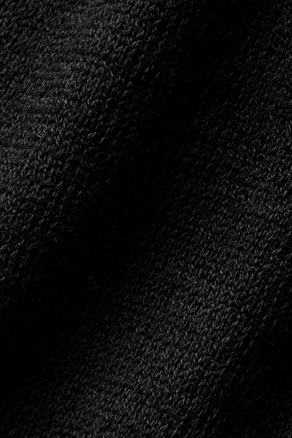 Close-up of lightweight black knit fabric of the Supernatural Sweater Henley Tank, highlighting its soft and breathable texture.