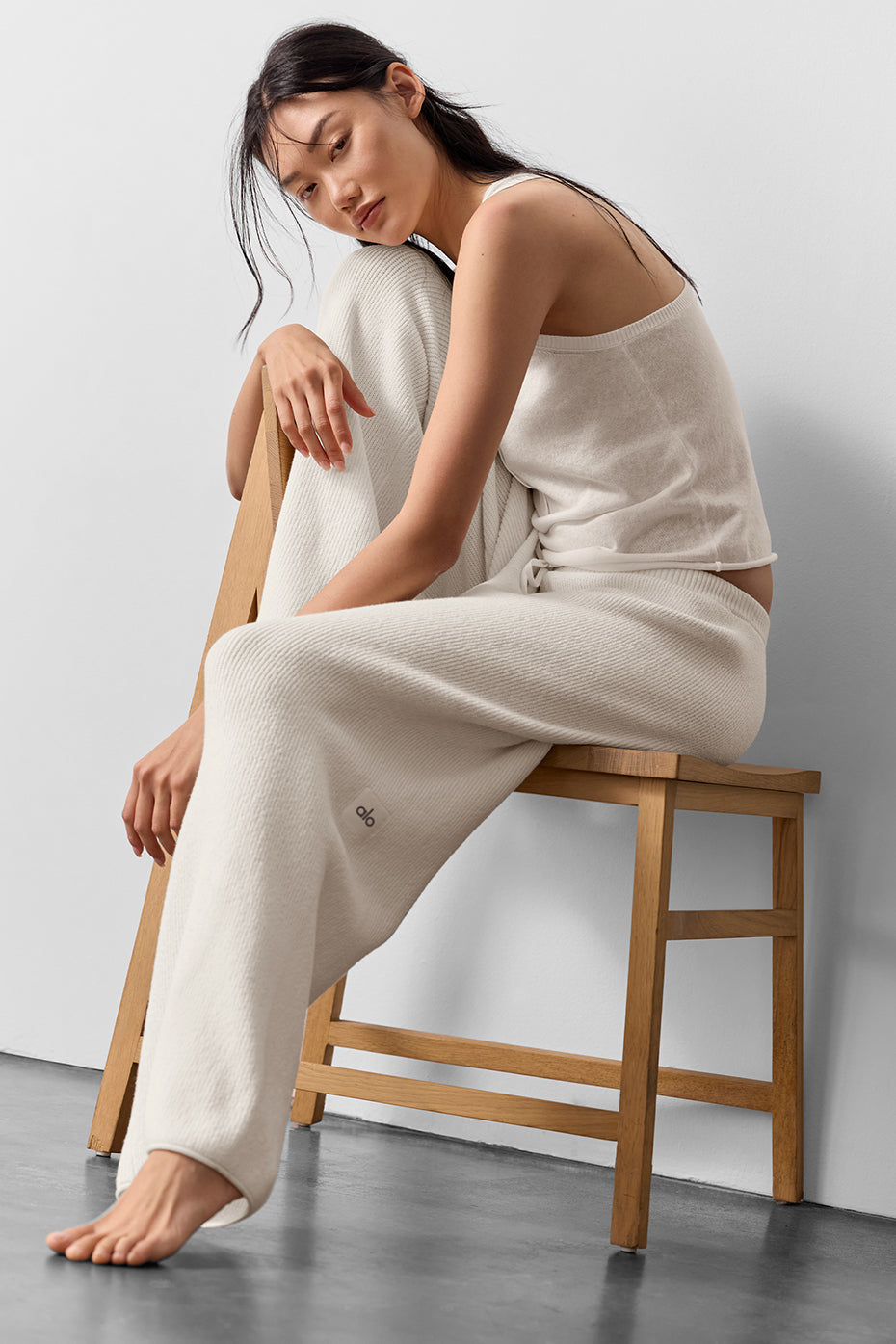 Model wearing Supernatural Sweater Henley Tank and matching pants, featuring a lightweight knit and relaxed fit.