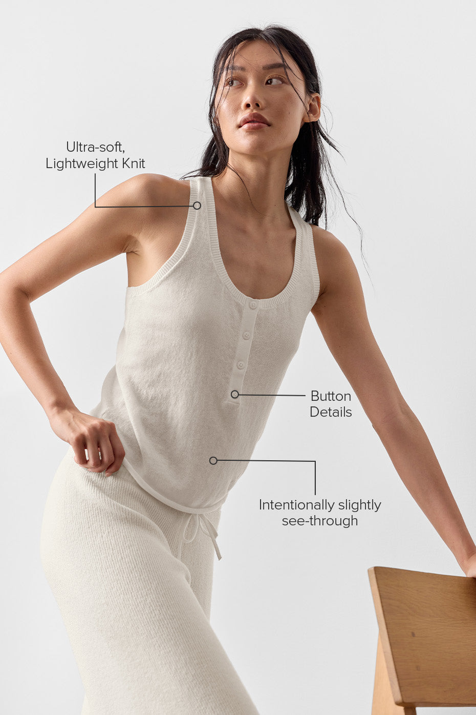 Model wearing Supernatural Sweater Henley Tank, showcasing its ultra-soft lightweight knit and button details.
