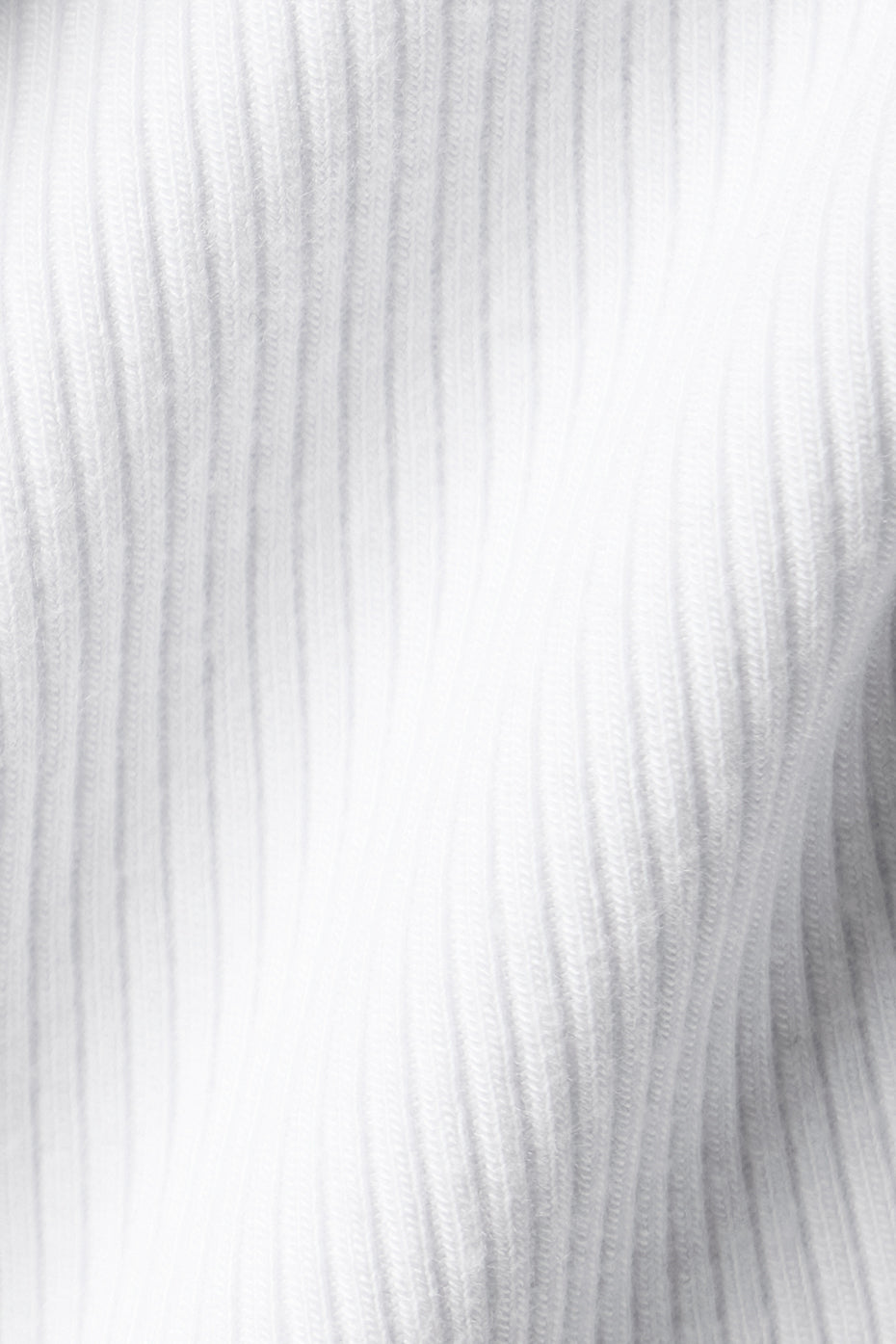 Close-up of silky-soft, stretchy ribbed fabric used for the Ribbed Prosper Tank in white.