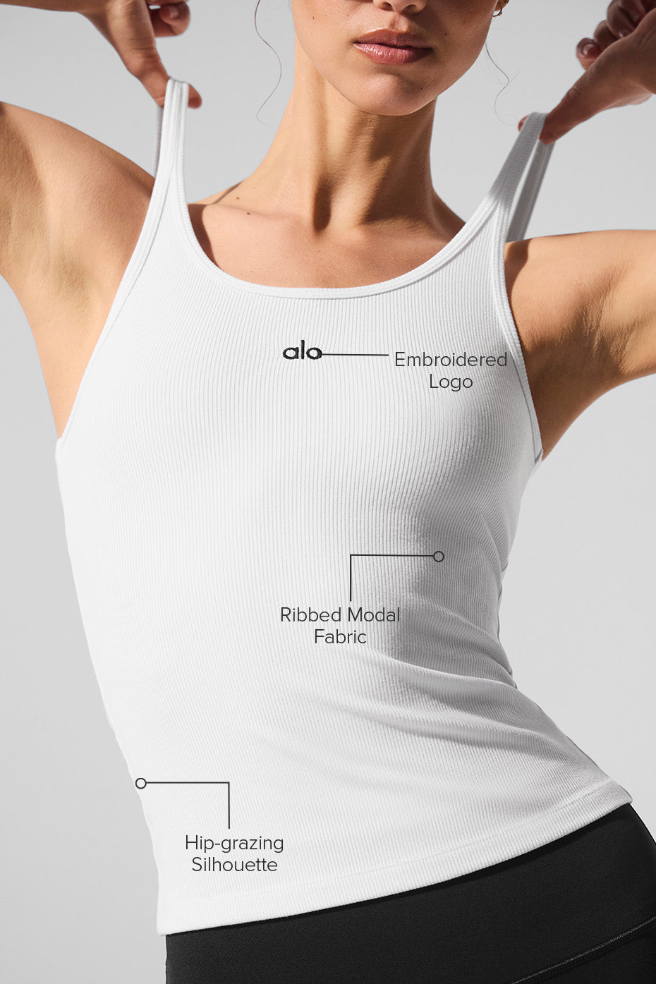 Model showcasing the Ribbed Prosper Tank featuring a silky-soft ribbed modal fabric and hip-grazing silhouette.