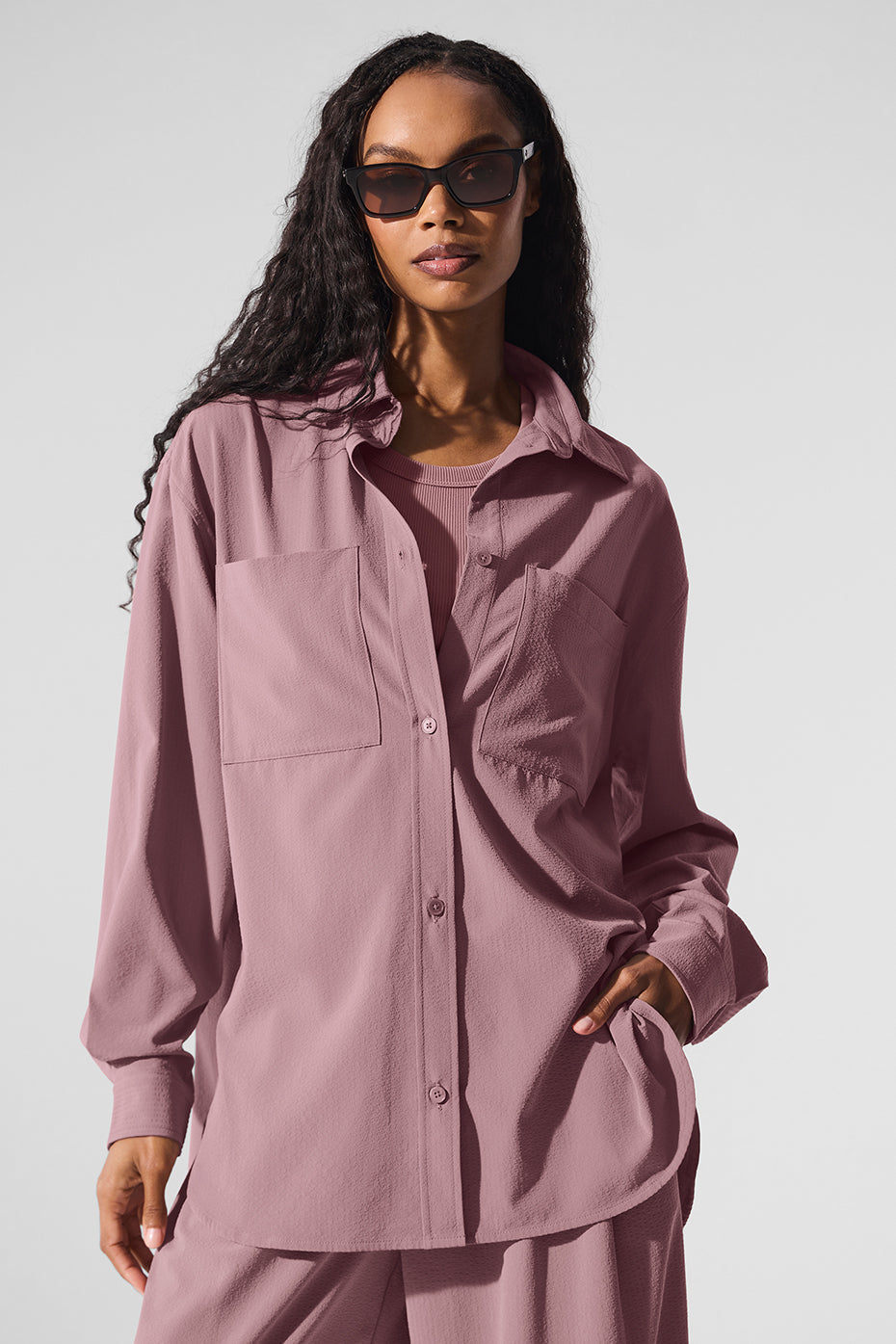 Dreamscape Button Down Long Sleeve in pink, oversized collared shirt with front pockets, paired with high-waist trousers.