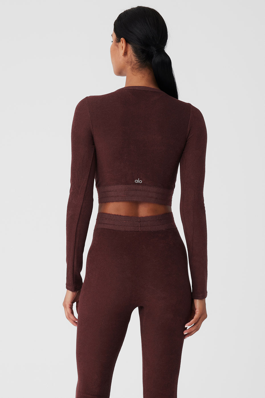 Women wearing Seamless Luxe Terry Cuddle Coverup, showcasing the back view and stretchy, warm fabric.