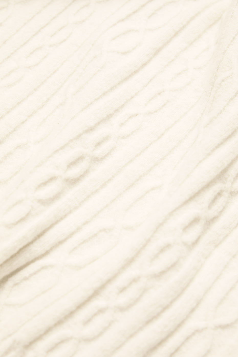 Close-up of the soft, chunky cable knit pattern on the Cable Knit Winter Bliss Hoodie in cream color.