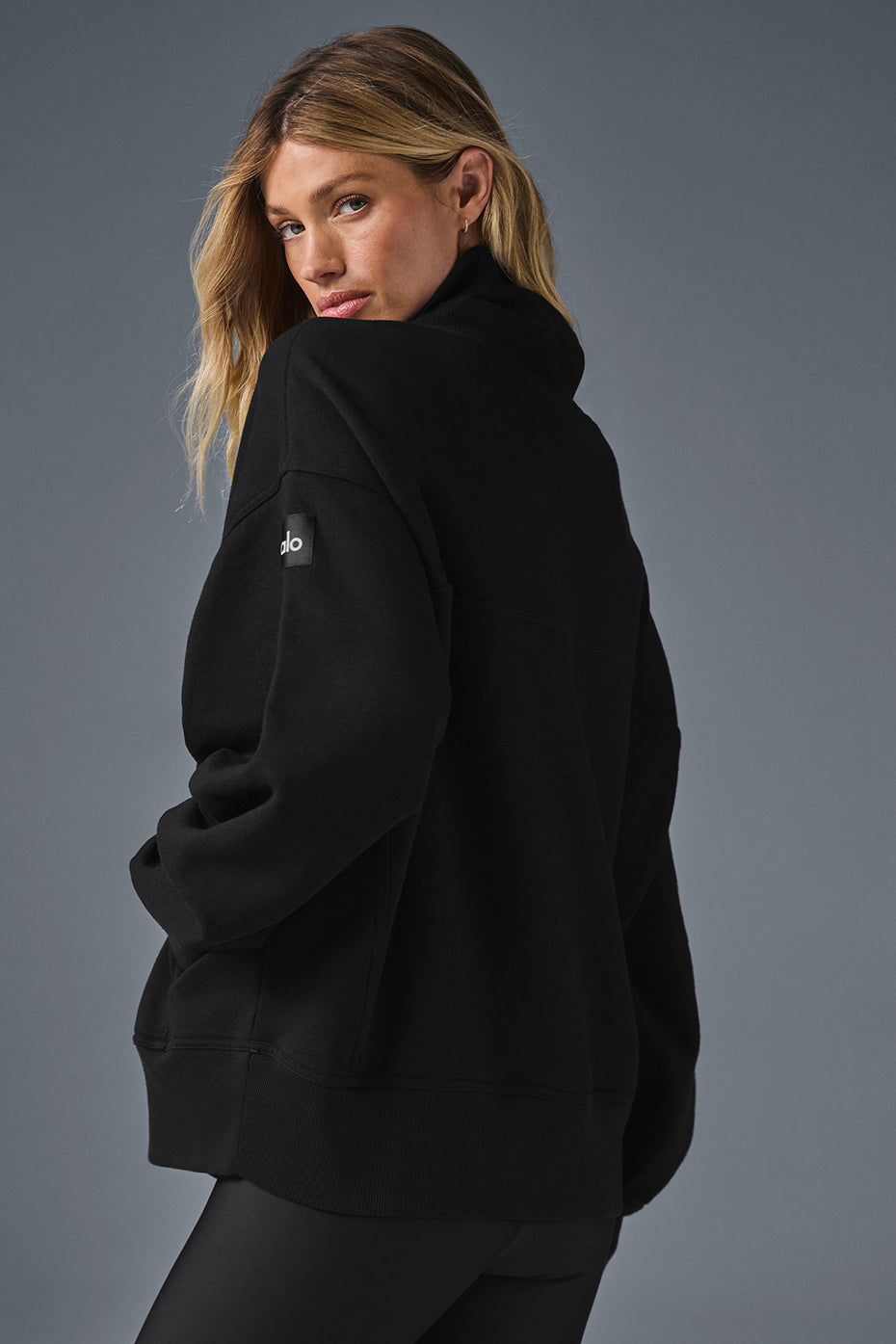 Hazy Mock Neck Pullover in black, showcasing an oversized fit, perfect for cozy daytime or laid-back lounge looks.