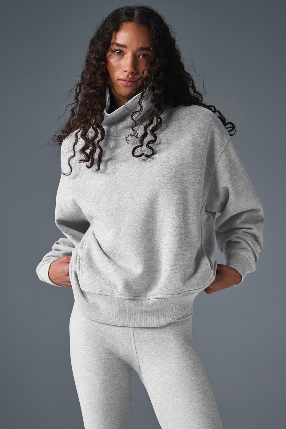 Hazy Mock Neck Pullover in gray on model, showcasing oversized fit perfect for cozy lounge looks.