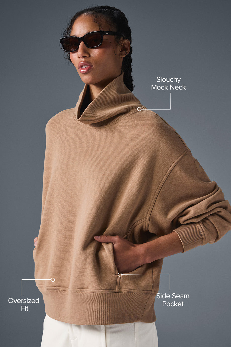 Model wearing hazy mock neck pullover sweater with oversized fit and side seam pocket, showcasing a cozy and stylish look.