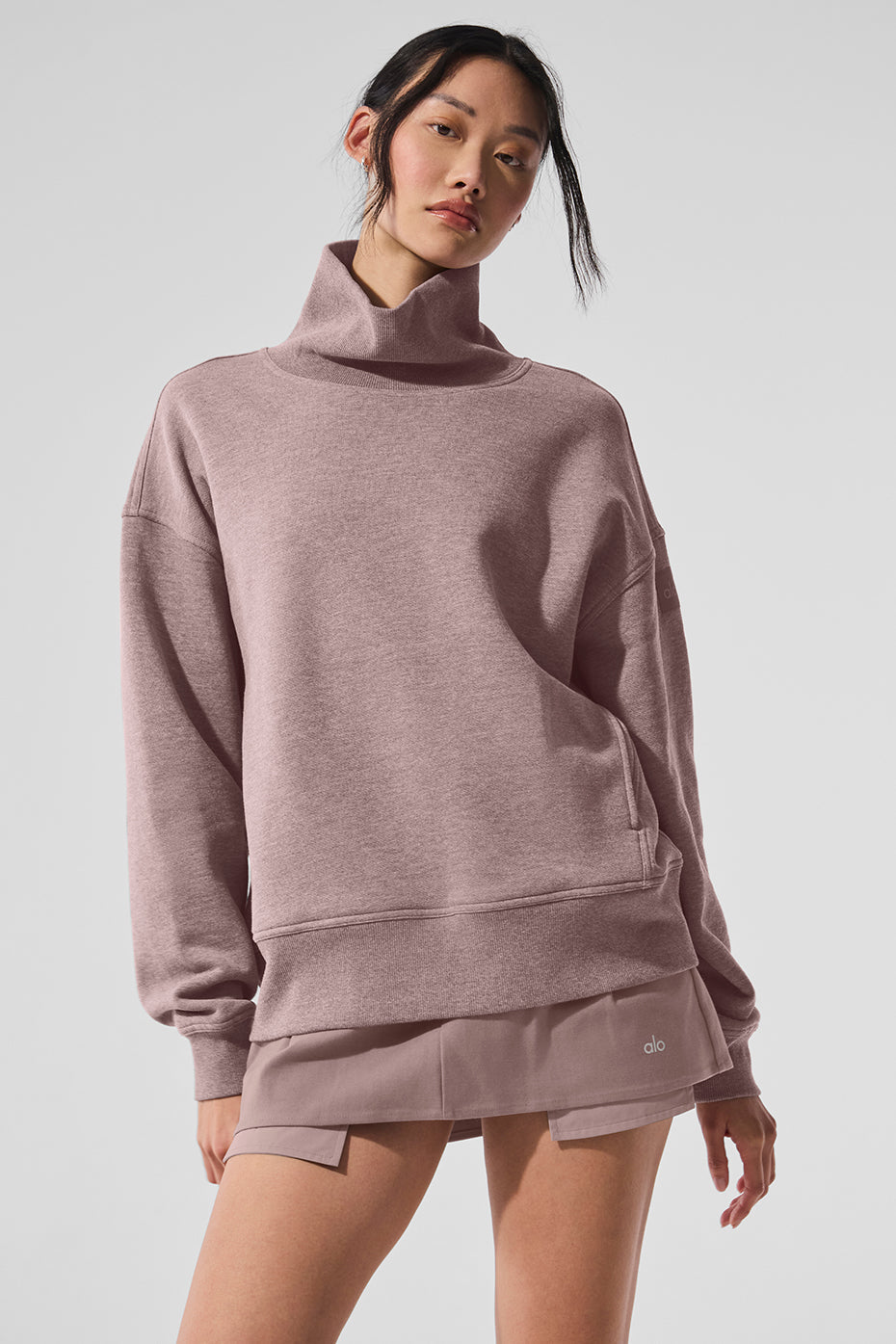 Hazy mock neck pullover sweater in soft pink oversized fit worn with matching shorts for a cozy casual look.