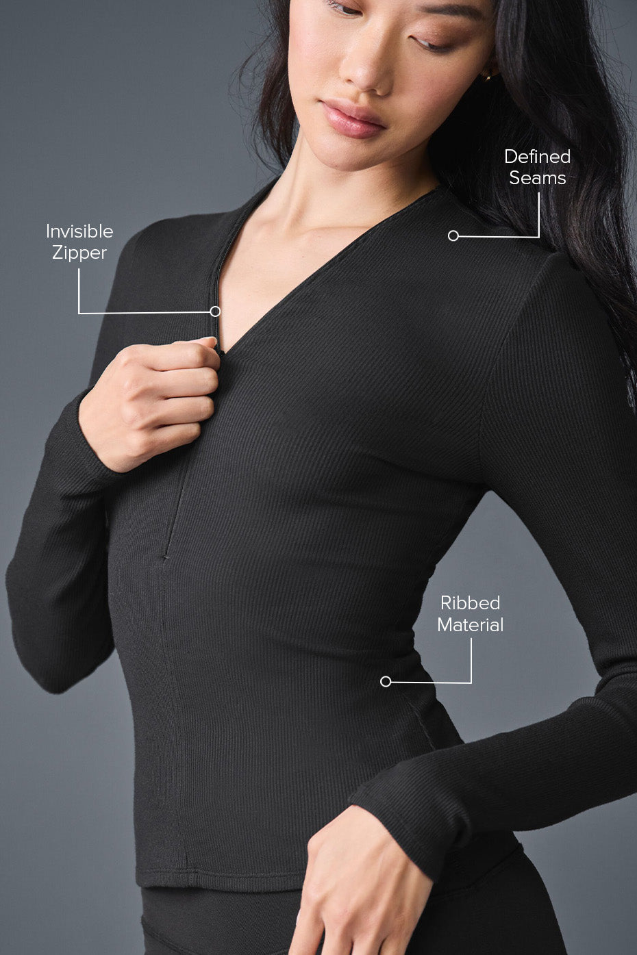 Model wearing Ribbed Mesmerize Long Sleeve showcasing the invisible zipper, defined seams, and ribbed material.