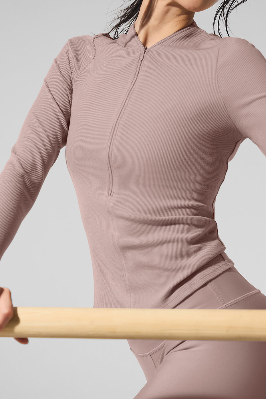 Ribbed Mesmerize Long Sleeve top with invisible zipper showcasing a close-to-body fit for a stylish look.