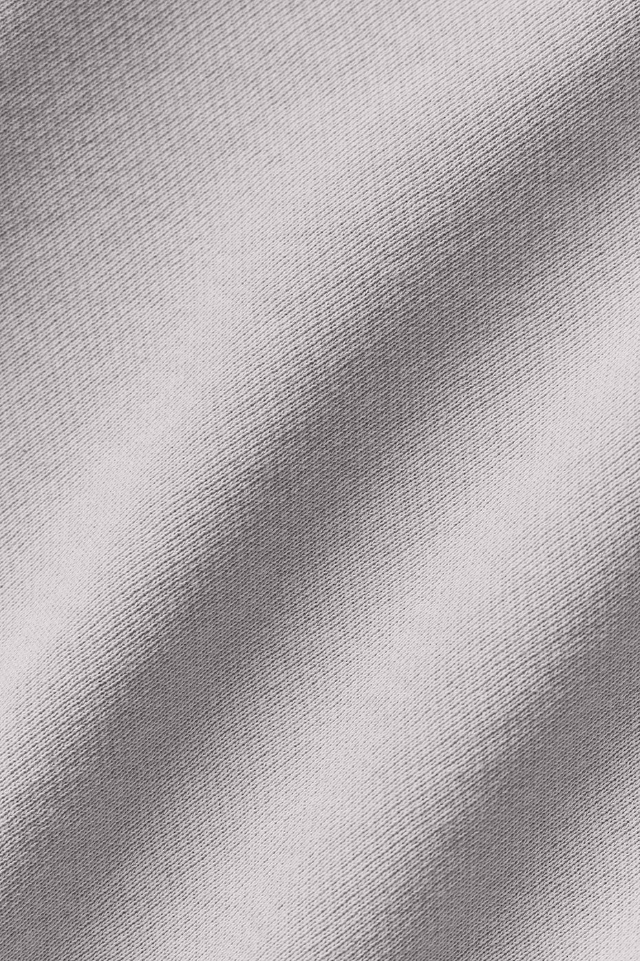 Close-up of washed fabric texture suitable for cropped pullover designs, showcasing softness and chic appeal.