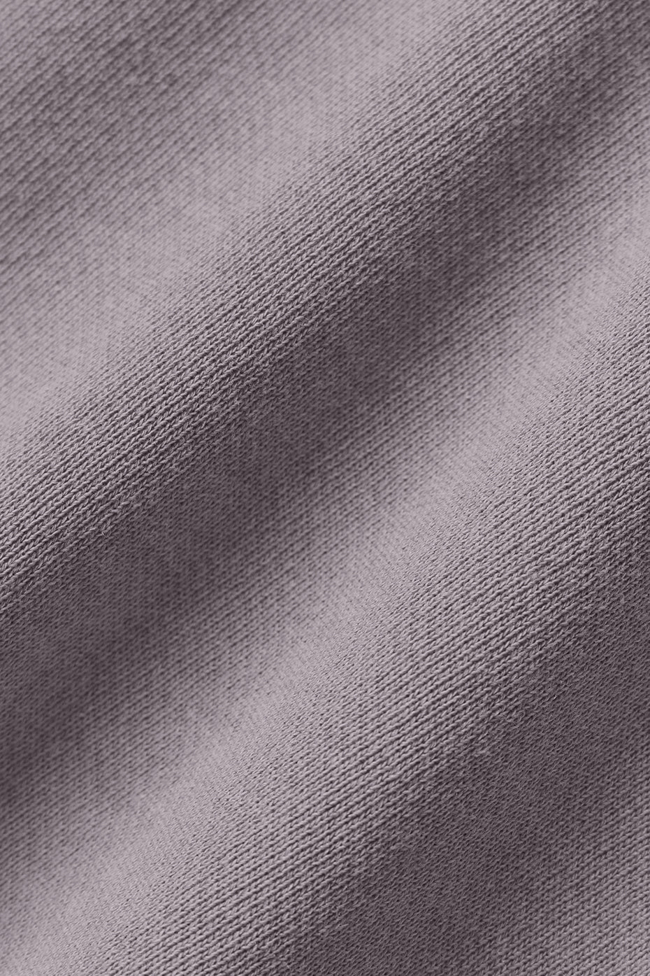 Close-up of washed fabric in a soft lavender hue for the Washed Extreme Cropped Pullover.