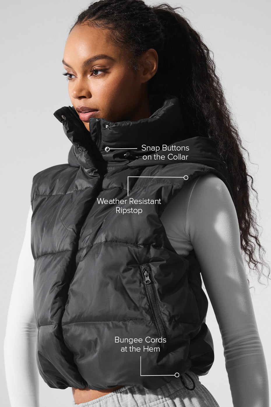 Close-up of the Gold Rush Puffer Vest showcasing snap buttons on collar and weather-resistant ripstop fabric.