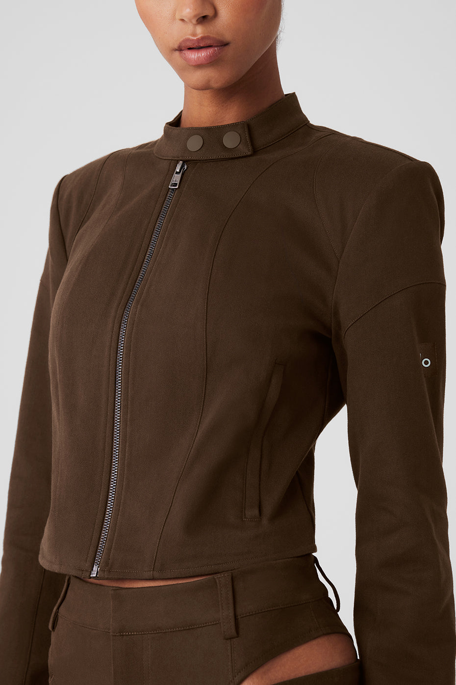 Cropped Full Throttle Moto Jacket featuring button neck, seamed panels, and full front zipper in a stylish brown hue.