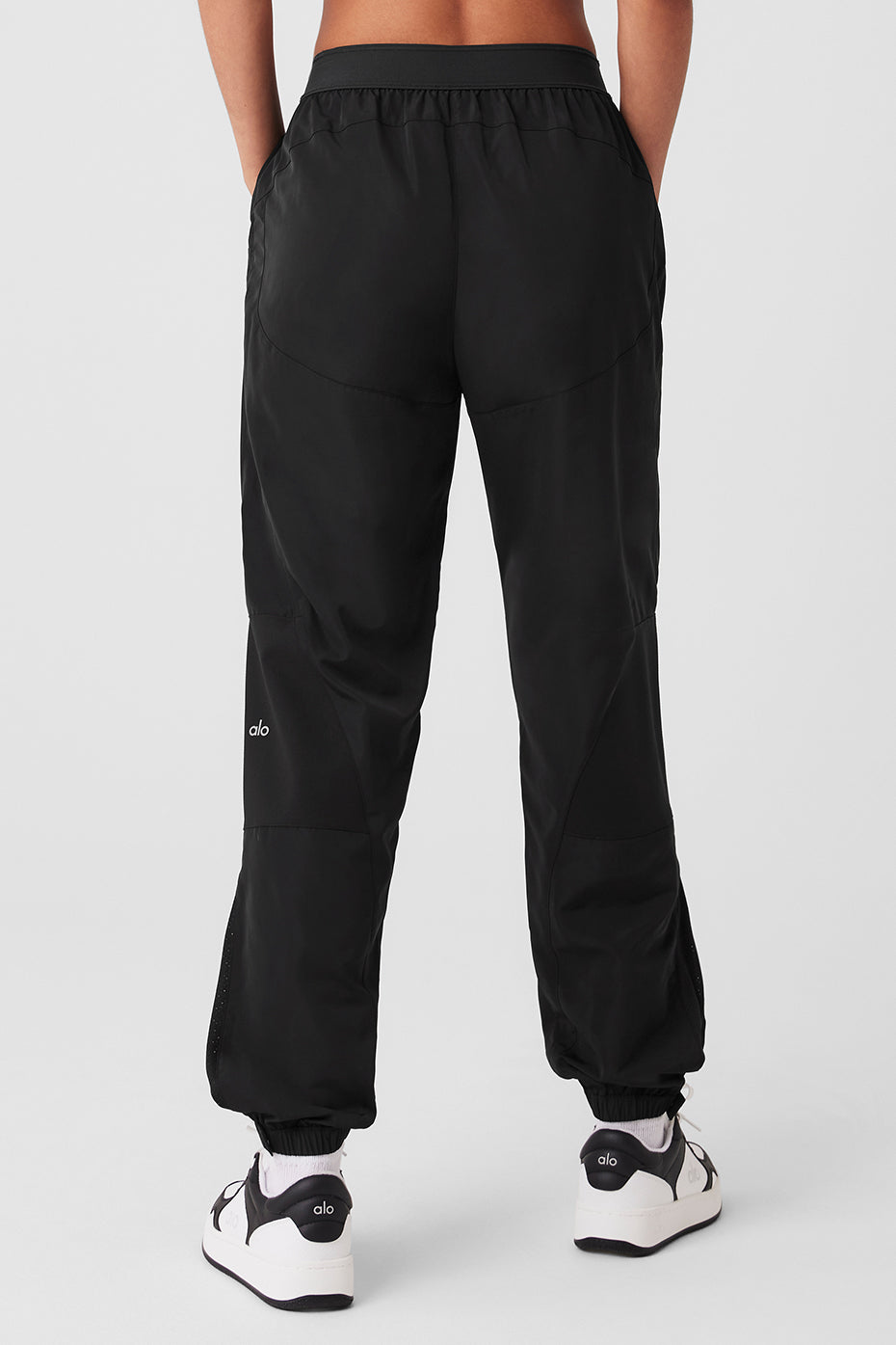 Back view of the Mixed Media Reinvention Jogger featuring a stretchy ALO waistband and relaxed fit.