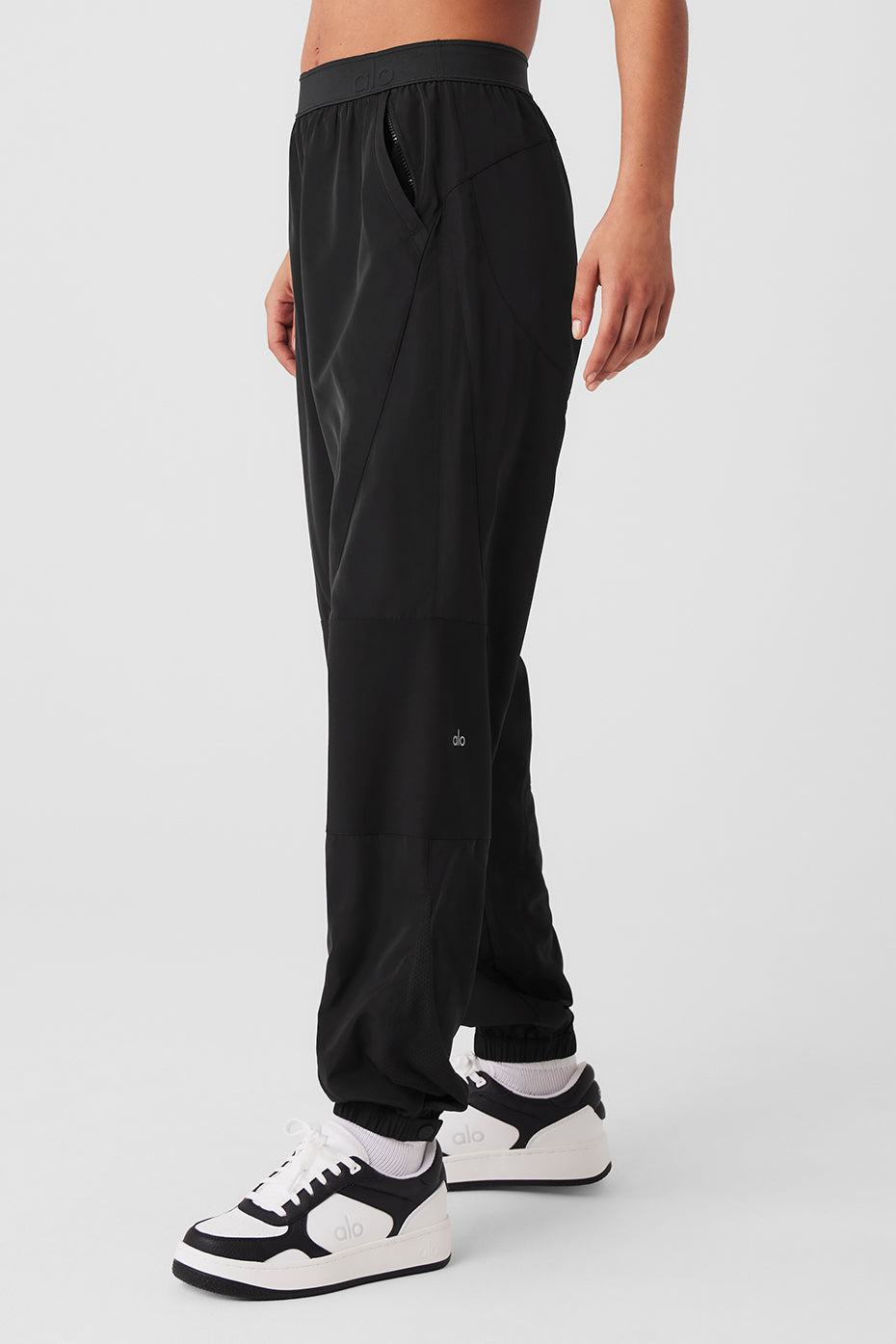 Mixed Media Reinvention Jogger in black with contrasting panels, relaxed fit, ALO waistband and stretchy cuffs.