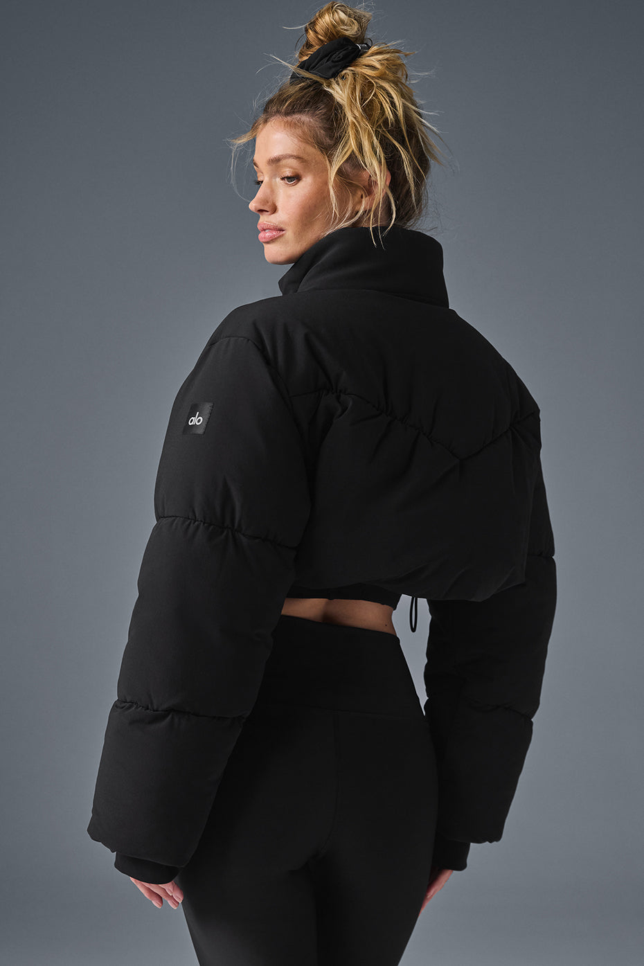 Main Act Corset Puffer jacket featuring a cropped silhouette and warm, lightweight design for chilly days.