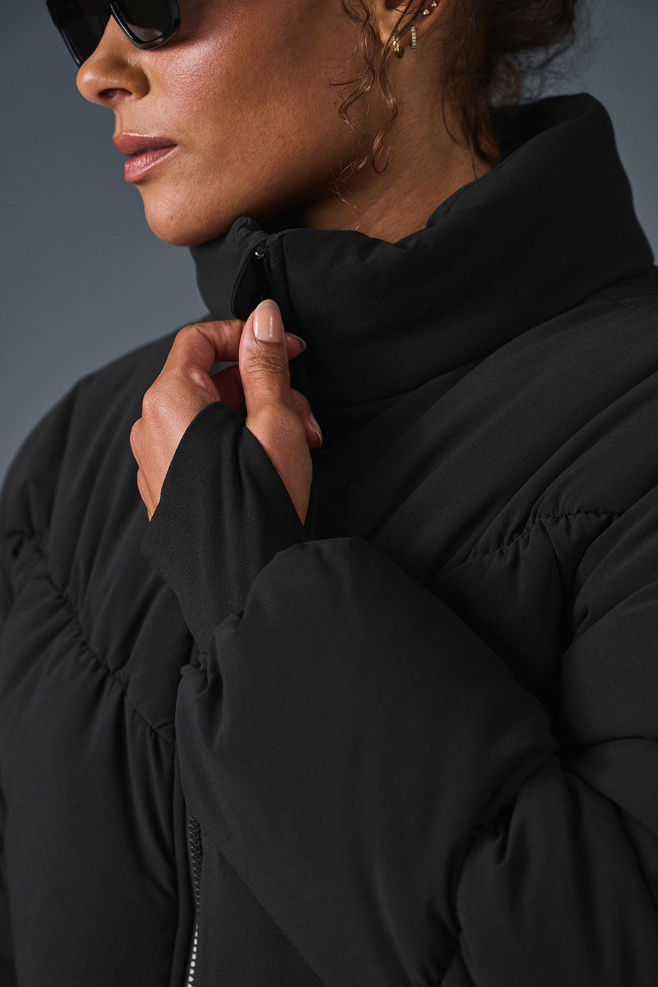 Main Act Corset Puffer jacket featuring a cropped silhouette and stylish collar in black, perfect for chilly days.