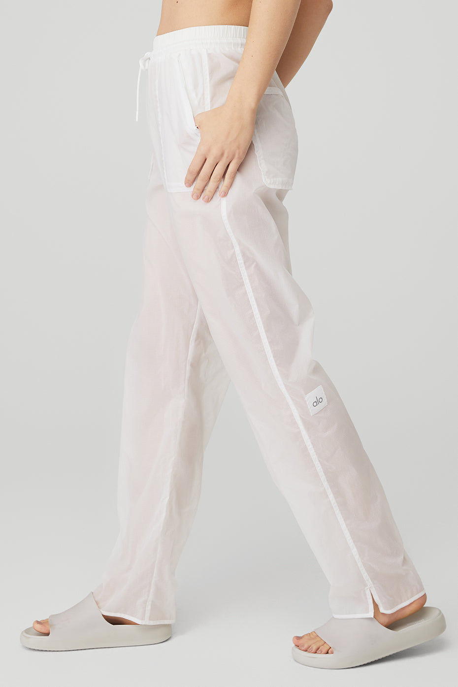 Cloud Nine Pant featuring lightweight ripstop fabric, high-waist design, and zippered pockets in white.