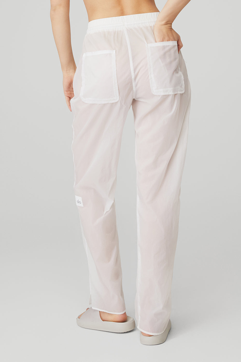 Cloud Nine Pant in lightweight ripstop fabric showcasing zippered pockets and high-waist design from the back.