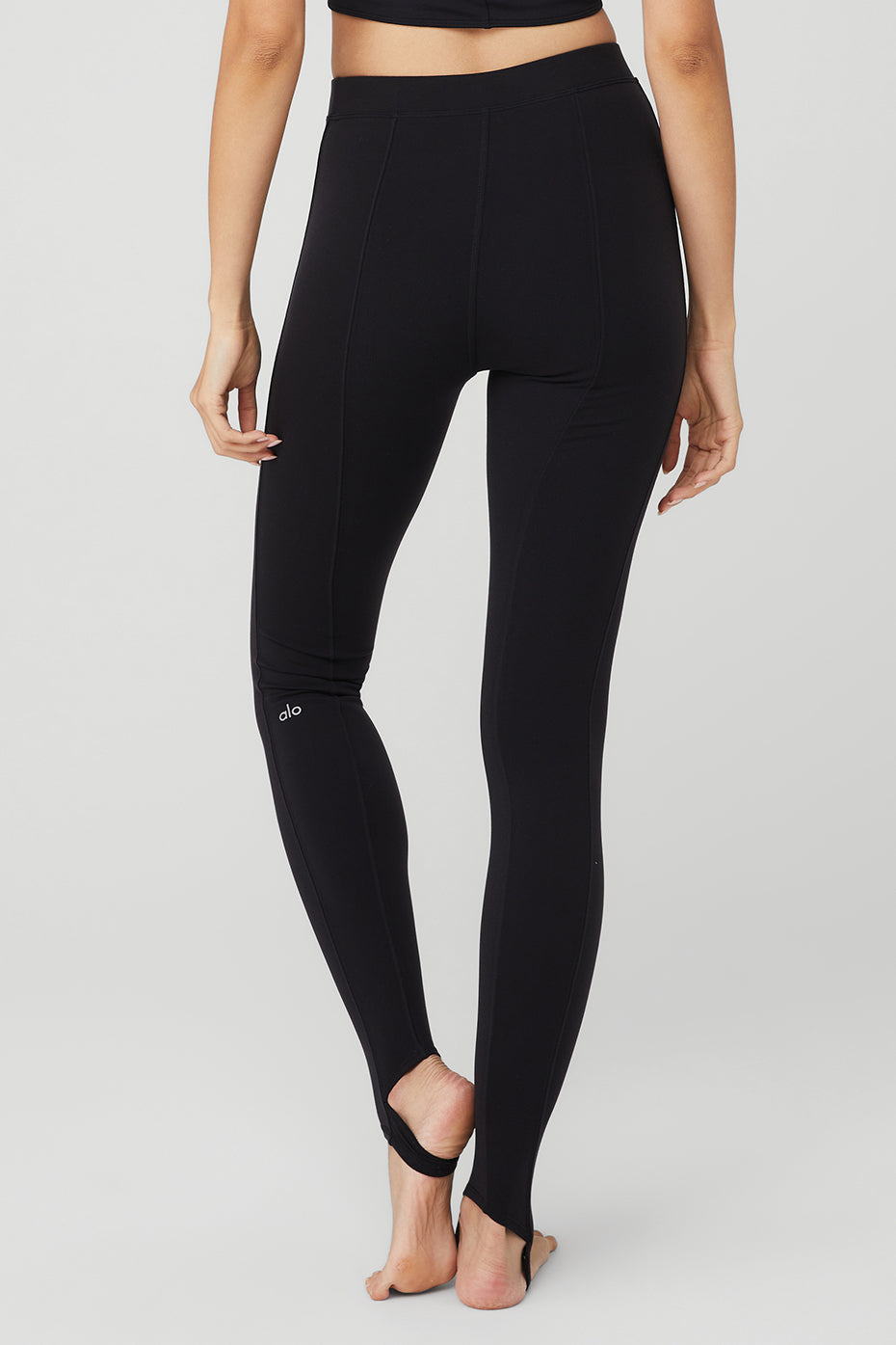 Back view of Airbrush High-Waist Enso Legging showcasing elevated seam detailing and toe hook for a sleek fit.
