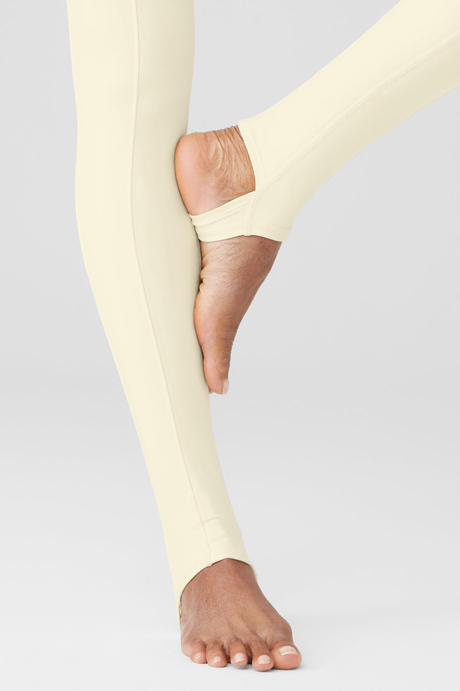 Airbrush High-Waist Enso Legging featuring toe hook and elevated seam detailing for a fitted look in a light color.