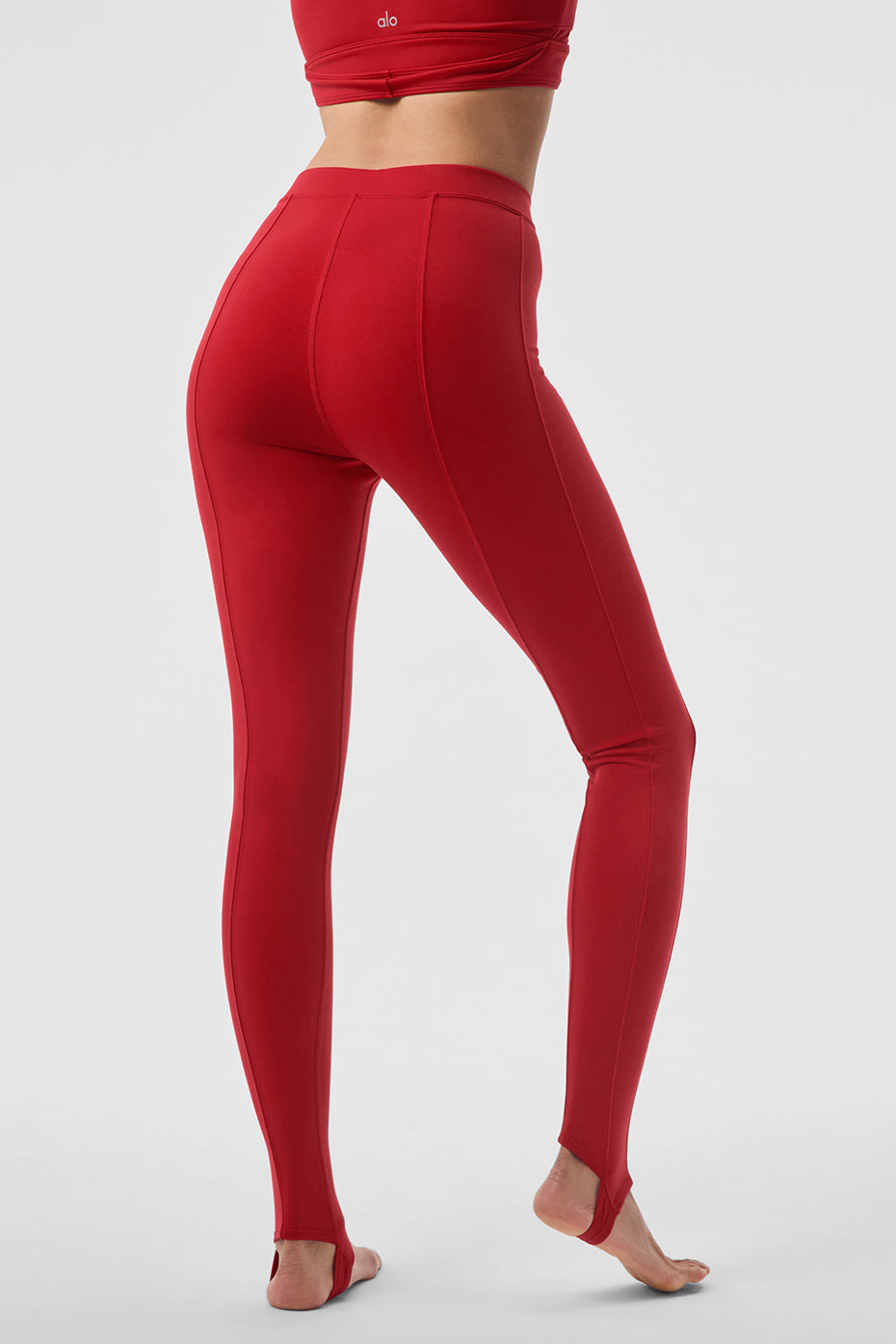 Airbrush High-Waist Enso Legging in red with elevated seam detailing and toe hook for Pilates workouts.