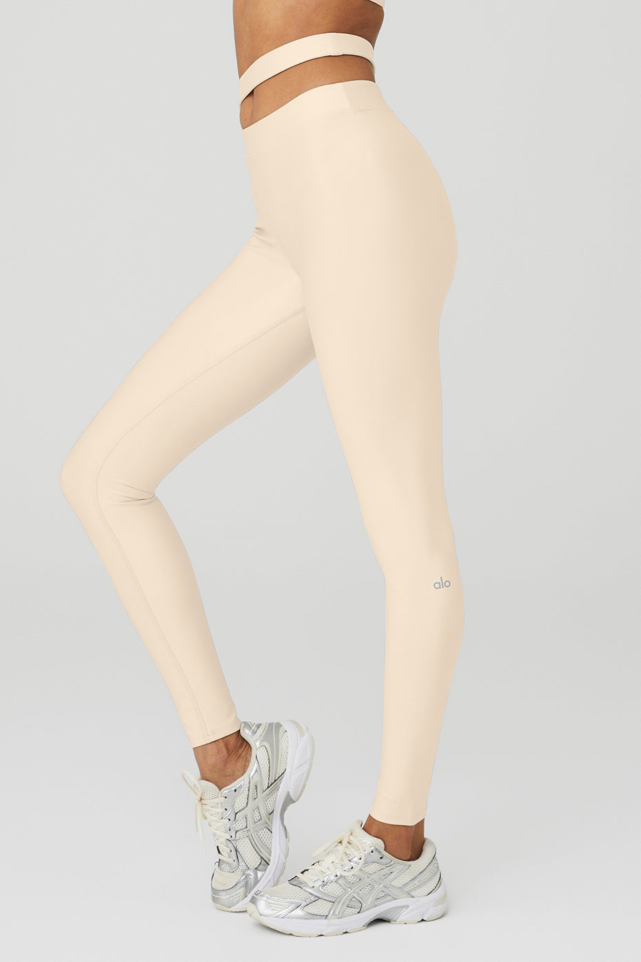 Airlift High-Waist All Access Legging in light beige with asymmetrical cutout waistband, perfect for studio and street wear.