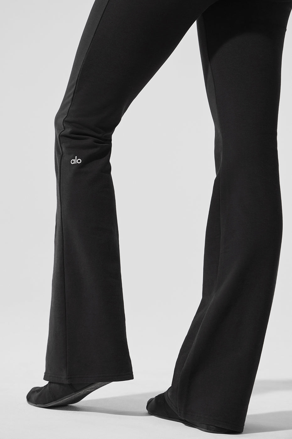 Sway Bootcut Sweatpant in black featuring tailored lines and a comfortable fit with a subtle logo detail.